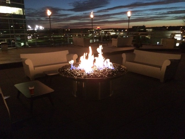 Round HPC Fire natural gas fire pit with fire glass on the rooftop of Black Sheep Social Club in Cedar Rapids